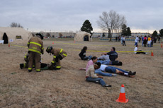 Fire personnel help patients during the exercise.