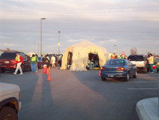 Cars pull up to the DRASH drive-thru H1N1 vaccination clinic in Madison County.